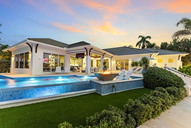 rear view of house featuring a patio area