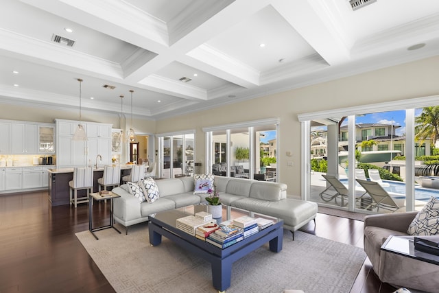 living room with beamed ceiling, dark hardwood / wood-style flooring, crown molding, and coffered ceiling