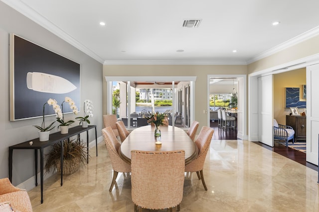 dining area featuring ornamental molding