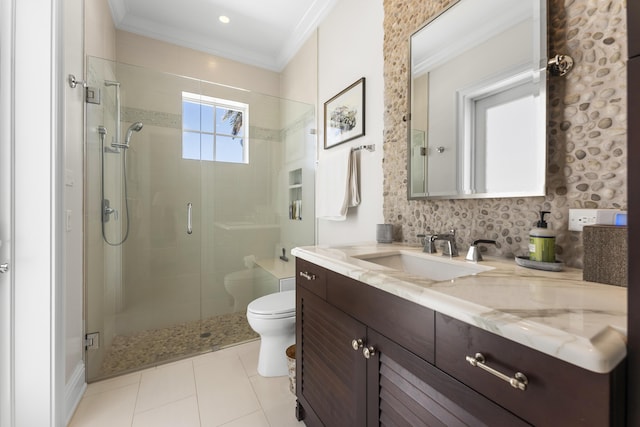 bathroom with vanity, toilet, ornamental molding, and a shower with door