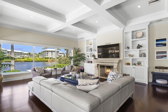 living room featuring beam ceiling, ornamental molding, dark wood-type flooring, and coffered ceiling