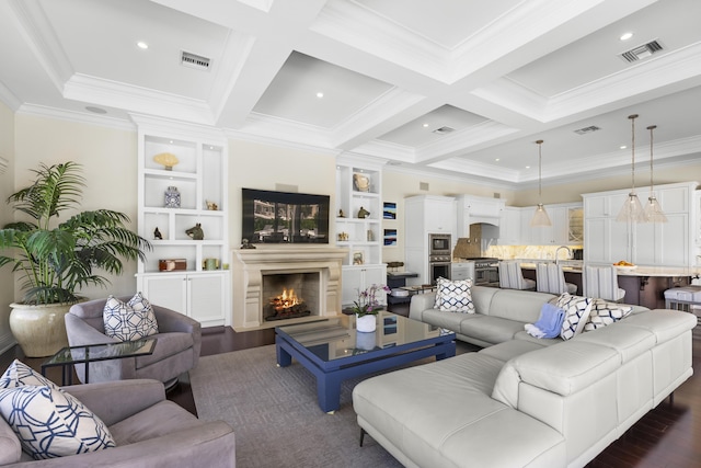 living room with ornamental molding, coffered ceiling, built in shelves, beamed ceiling, and dark hardwood / wood-style floors