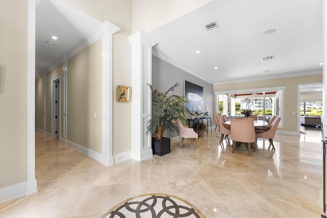 dining area with crown molding