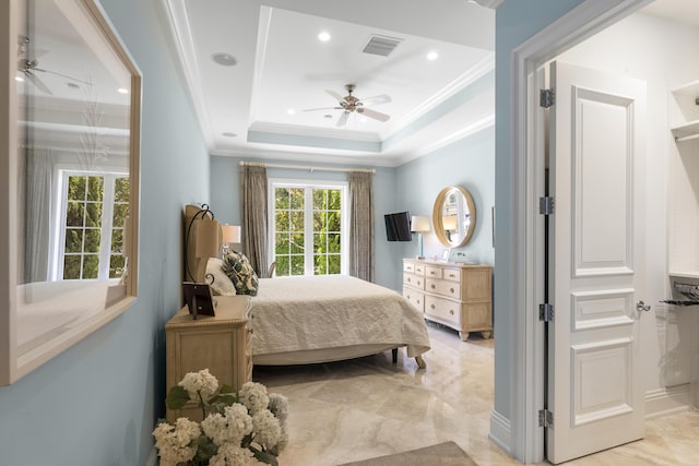 bedroom with a raised ceiling, multiple windows, ceiling fan, and crown molding