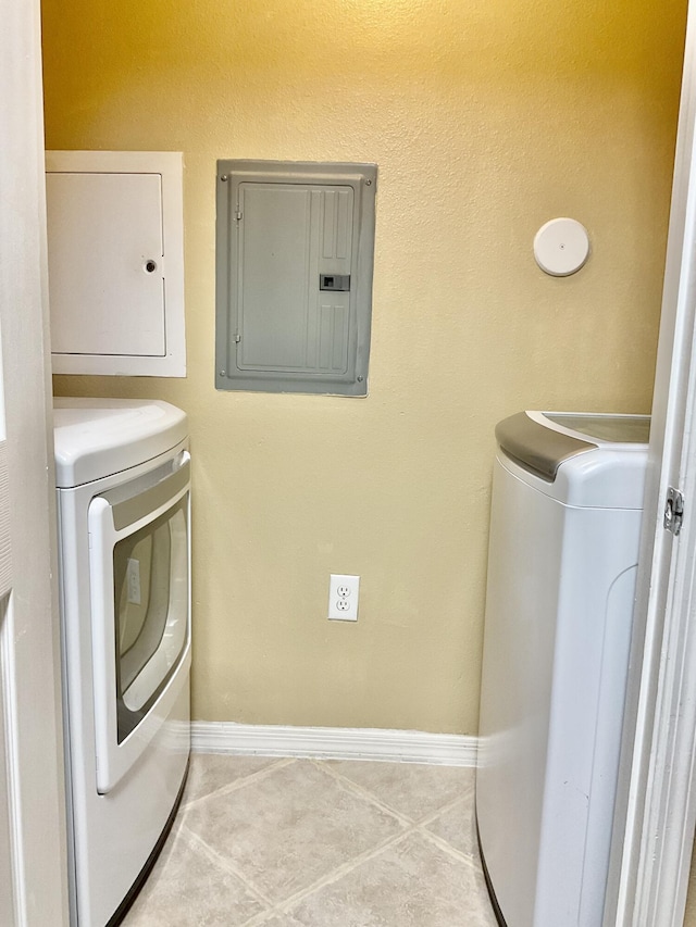 washroom with light tile patterned floors, independent washer and dryer, and electric panel