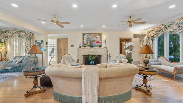 bedroom featuring ceiling fan, crown molding, and hardwood / wood-style flooring