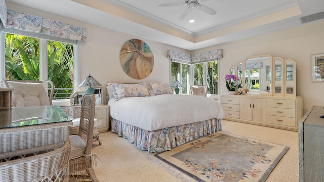 bedroom featuring recessed lighting, light carpet, visible vents, a raised ceiling, and crown molding