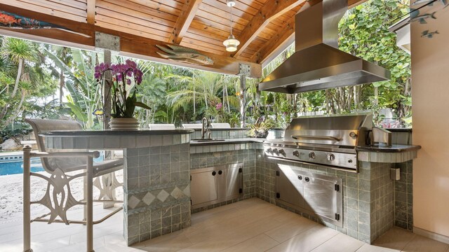 full bathroom featuring tile patterned floors, tile walls, shower / bath combination with glass door, and toilet