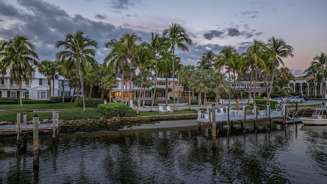 exterior space featuring a water view and a lawn