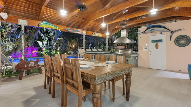 dining room featuring lofted ceiling with beams and wooden ceiling