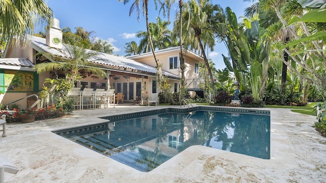 pool featuring a patio area