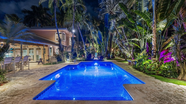 outdoor pool with a patio area