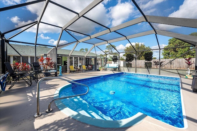 view of pool featuring a lanai and a patio