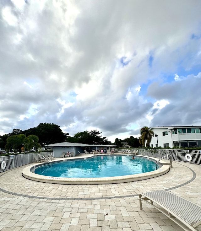 view of swimming pool with a patio area