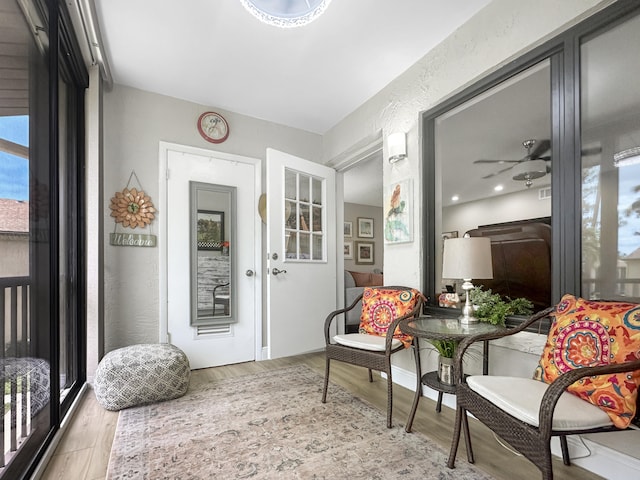 interior space with light hardwood / wood-style floors and ceiling fan