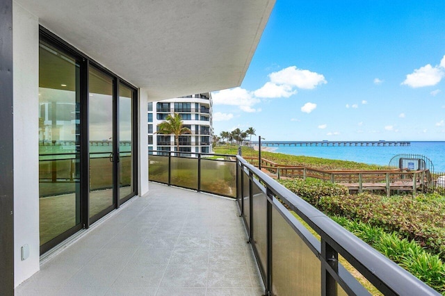 balcony featuring a water view