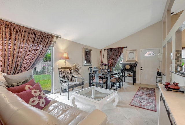 tiled living room featuring vaulted ceiling