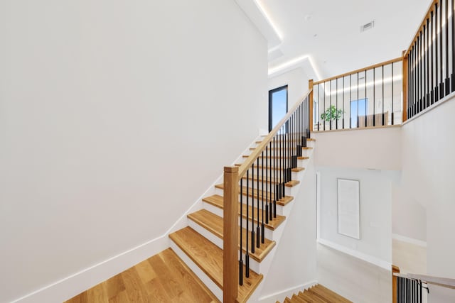 staircase featuring hardwood / wood-style floors