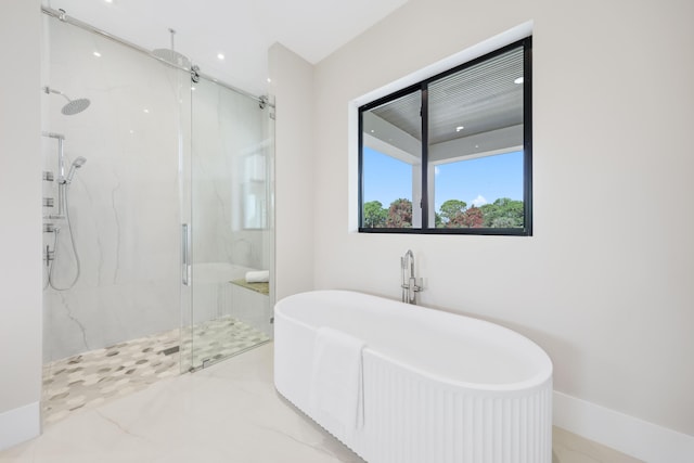 bathroom featuring separate shower and tub