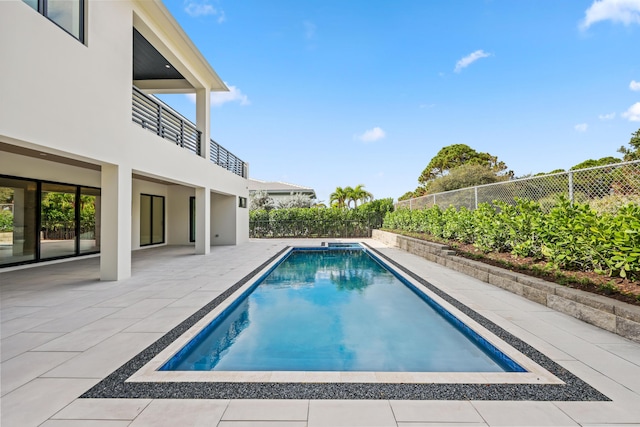 view of swimming pool featuring a patio area