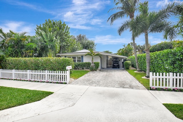 single story home featuring a carport