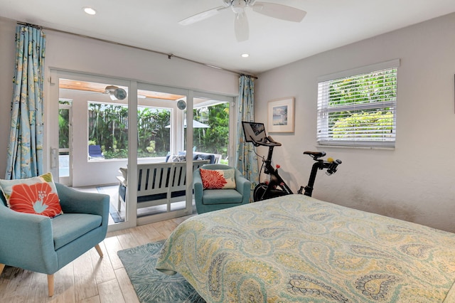 bedroom with access to exterior, multiple windows, light hardwood / wood-style floors, and ceiling fan