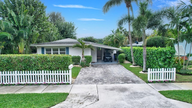 ranch-style home featuring a carport