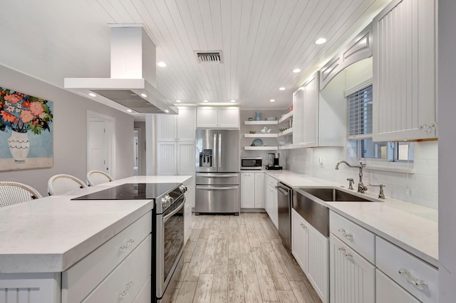 kitchen featuring island range hood, wooden ceiling, white cabinetry, and appliances with stainless steel finishes