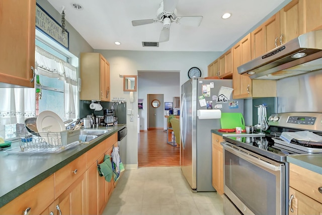 kitchen featuring stainless steel appliances and ceiling fan