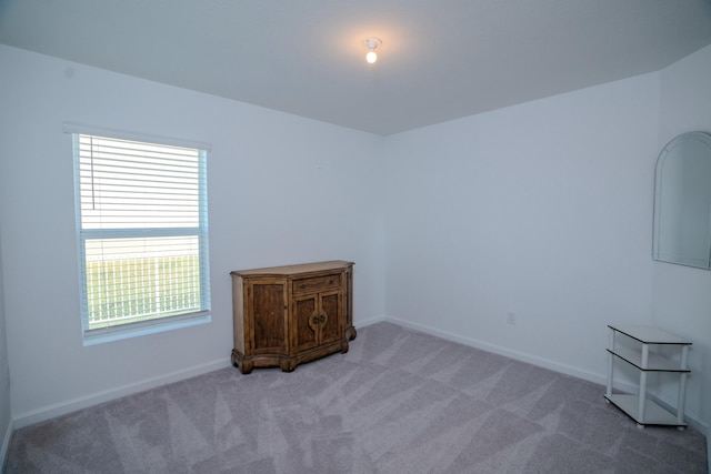 unfurnished room featuring carpet floors