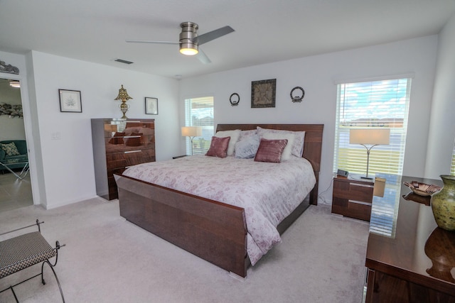 bedroom featuring ceiling fan and light colored carpet