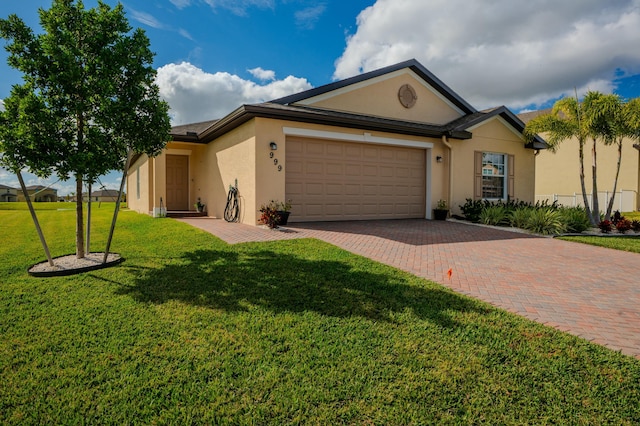 single story home featuring a garage and a front yard