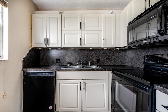 kitchen with black appliances, backsplash, white cabinetry, and sink