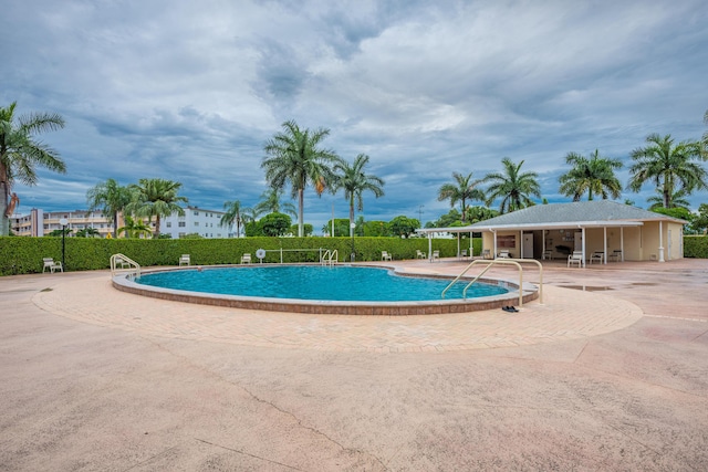 view of pool featuring a patio