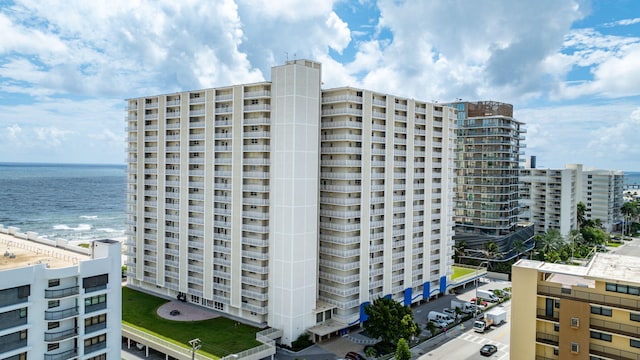 view of building exterior with a water view