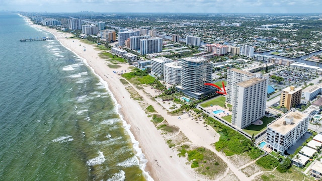 aerial view featuring a water view and a beach view