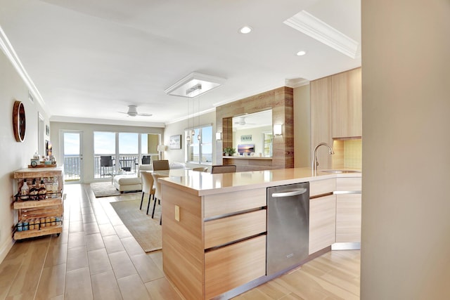 kitchen with light brown cabinetry, ornamental molding, ceiling fan, sink, and dishwasher