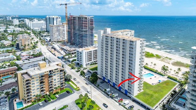 aerial view featuring a water view and a beach view