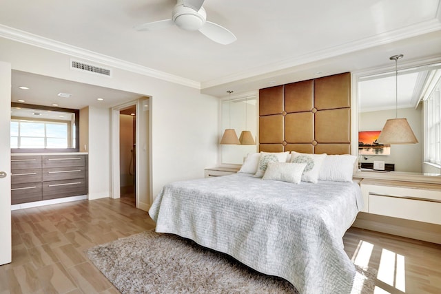 bedroom with light wood-type flooring, ceiling fan, and crown molding