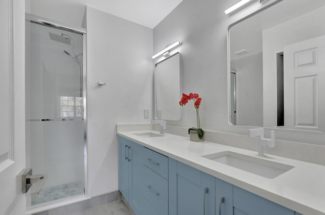 bathroom with vanity and walk in shower