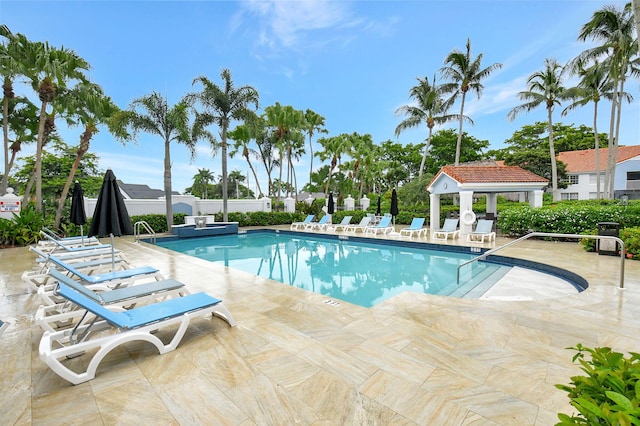 view of swimming pool with a patio area