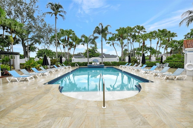 view of swimming pool featuring a patio area