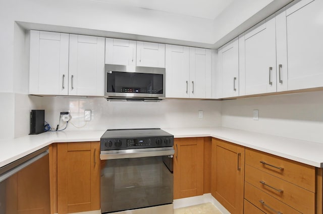 kitchen with white cabinets and stainless steel appliances