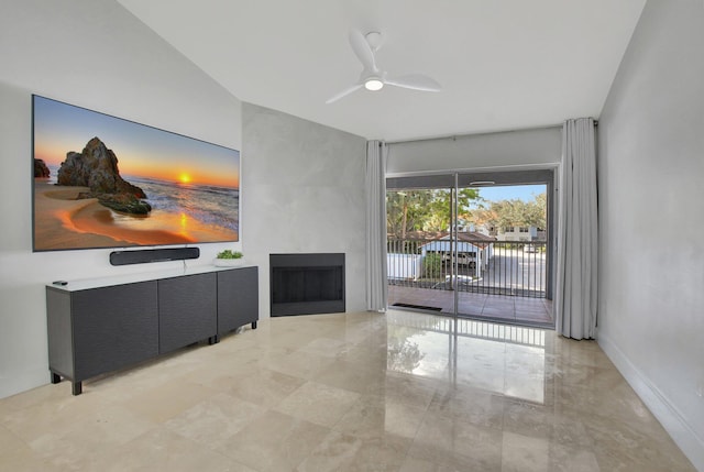 living room with ceiling fan and a large fireplace