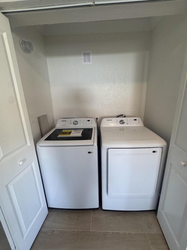 laundry area featuring independent washer and dryer