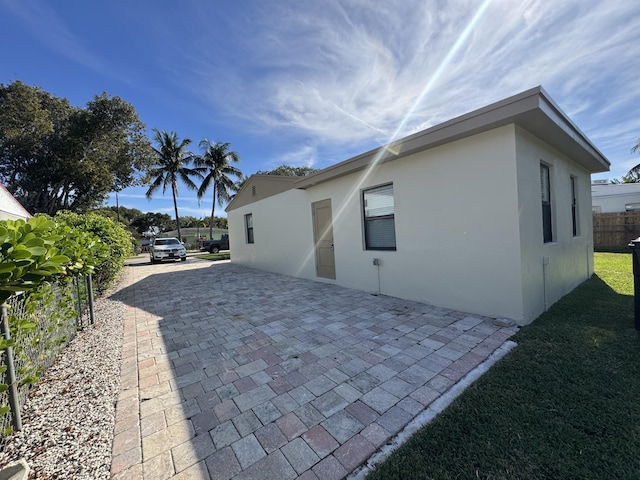 view of side of home featuring a patio