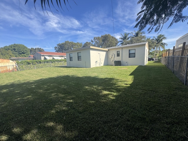 view of yard with central AC