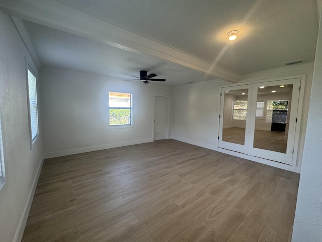 3015 Robert Rd, West Palm Beach, FL 33405 - spare room featuring wood-type flooring, ornamental molding, ceiling fan, and french doors