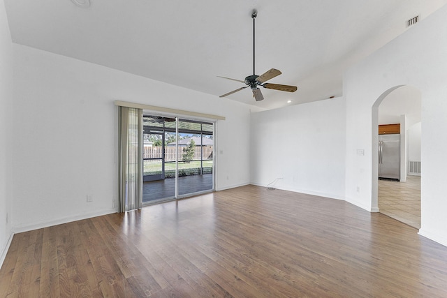 spare room with ceiling fan and wood-type flooring