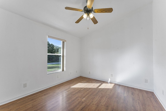 empty room featuring ceiling fan, lofted ceiling, and hardwood / wood-style flooring